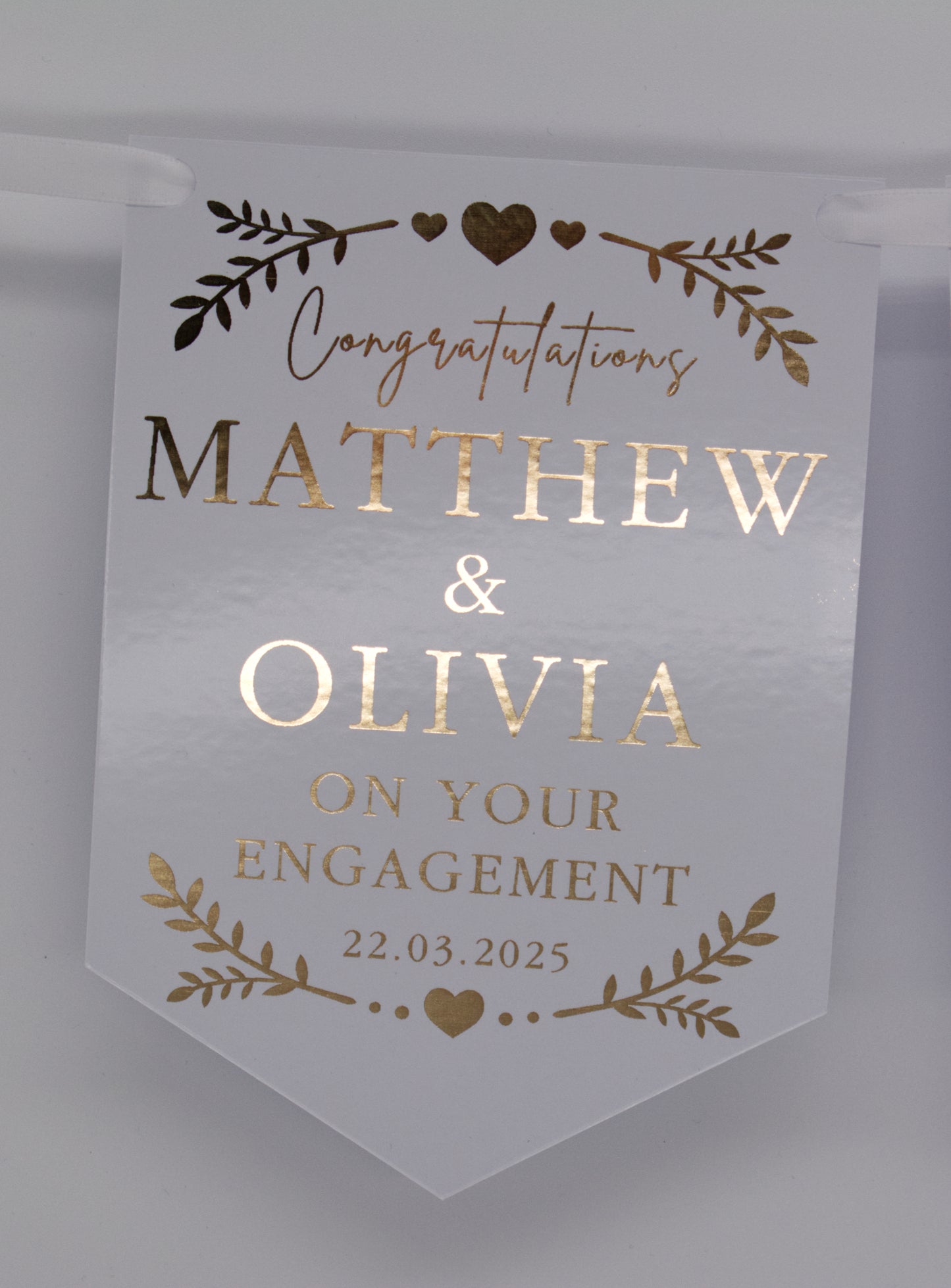 Foiled Engagement or Anniversary Bunting with greenery and hearts design in Gold. Personalised with Congratulations, Names and Date. Made from 300gsm single sided gloss card