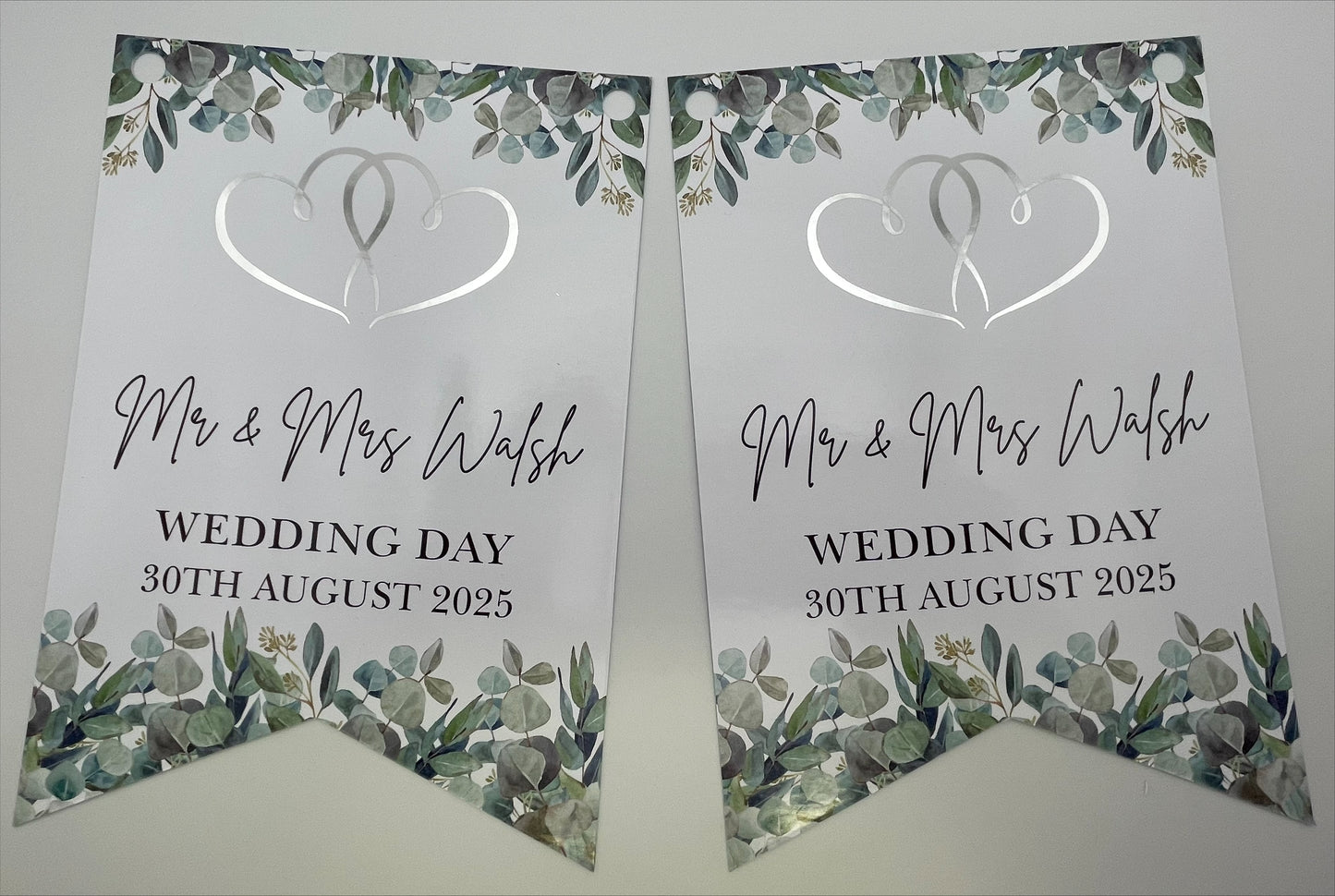 wedding bunting with eucalyptus, Silver foil hearts and personalised with mr & mrs Surname, wedding day and Date. Made from 300gsm single sided gloss cardstock