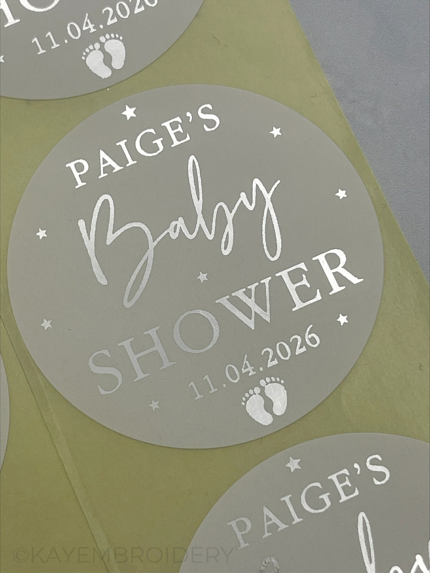 Baby Shower White Stickers foiled in Silver stars and baby feet. personalised with name and date