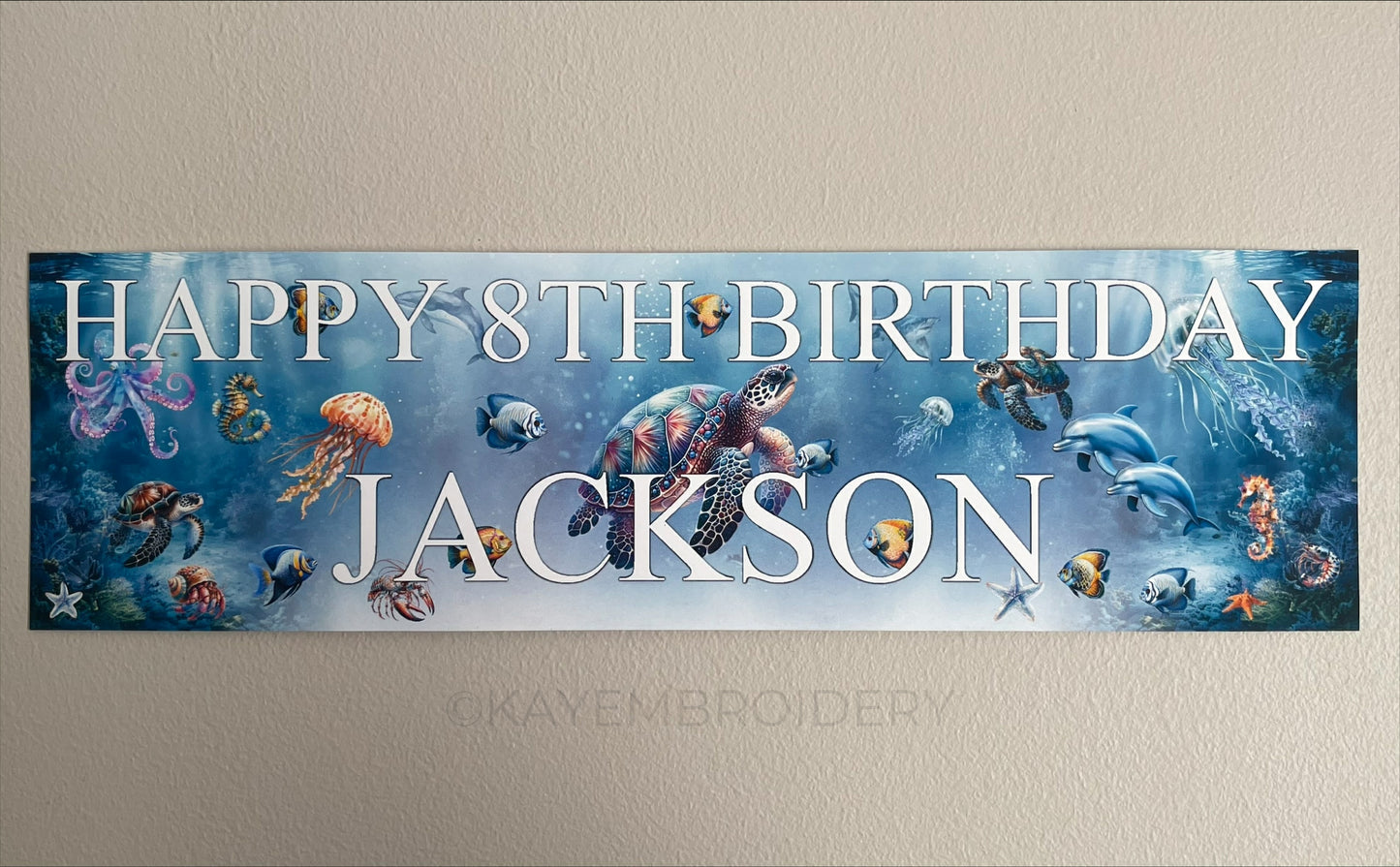 Under the sea birthday banner with marine sea life such as Turtle, Fish, Jellyfish, Octopus theme. Personalised with happy age birthday and name