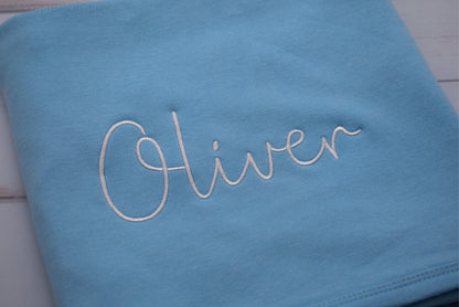 Close up name in white embroidery on Blue Cotton Baby Blanket