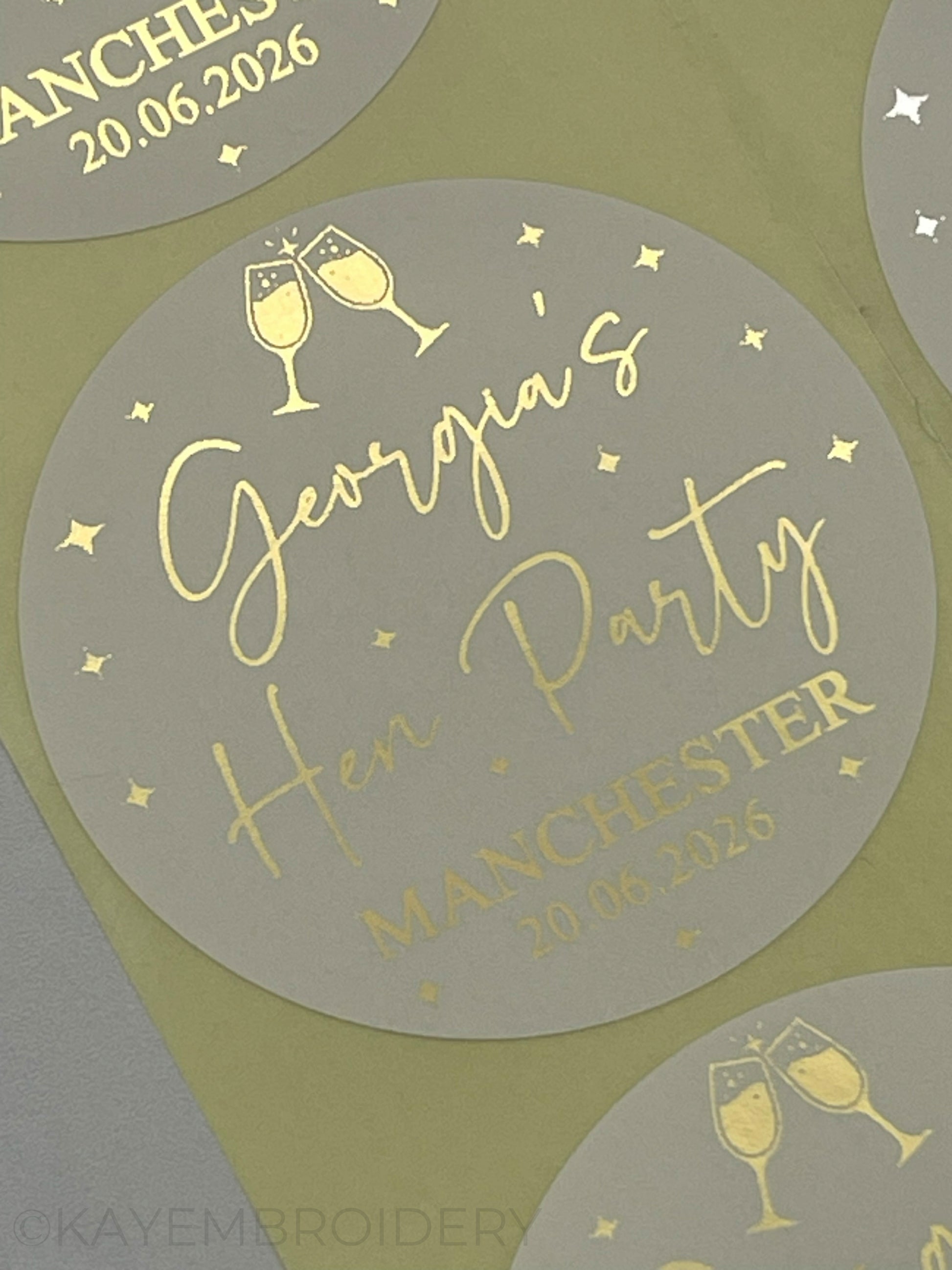 Close up of Hen party Gold Foiled Stickers personalised with name and date