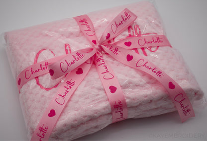 Embroidered Baby Waffle Blanket with name in Pink, embroidery is done in a darker shade gift wrapped with Ribbon