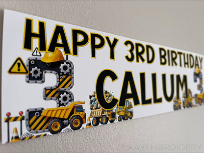 Personalised Birthday Banner featuring a yellow and black construction theme with trucks, gears and balloons