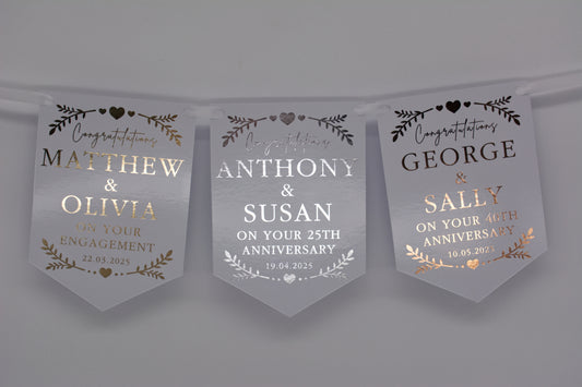 Foiled Engagement or Anniversary Bunting with greenery and hearts design in Gold, Silver, Rose Gold. Personalised with Congratulations, Names and Date. Made from 300gsm single sided gloss card