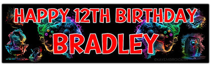 birthday banner with multicolour controller, PC, Headphones, keyboard, Chair gaming theme personalised with name and age in red Text