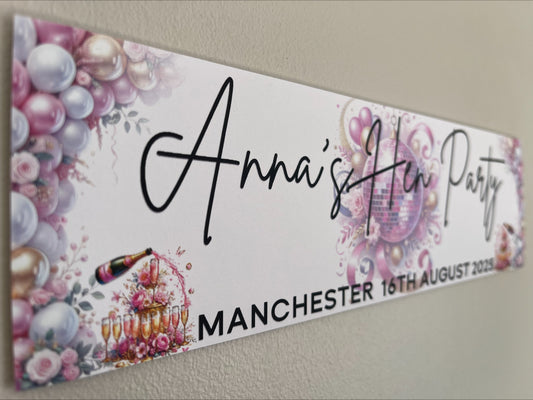 Hen party banner with pink white and gold personalised with name, place and date