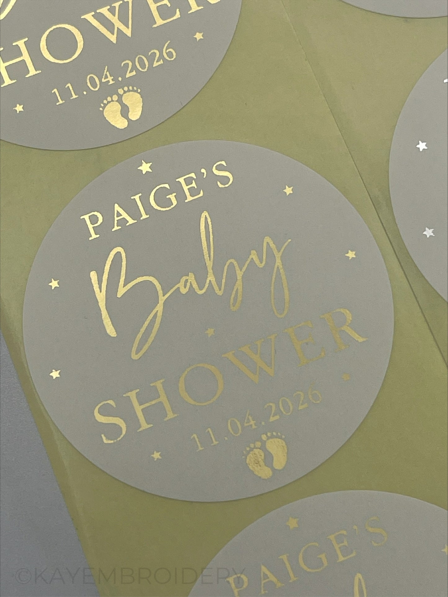 Baby Shower White Stickers foiled in Gold stars and baby feet. personalised with name and date