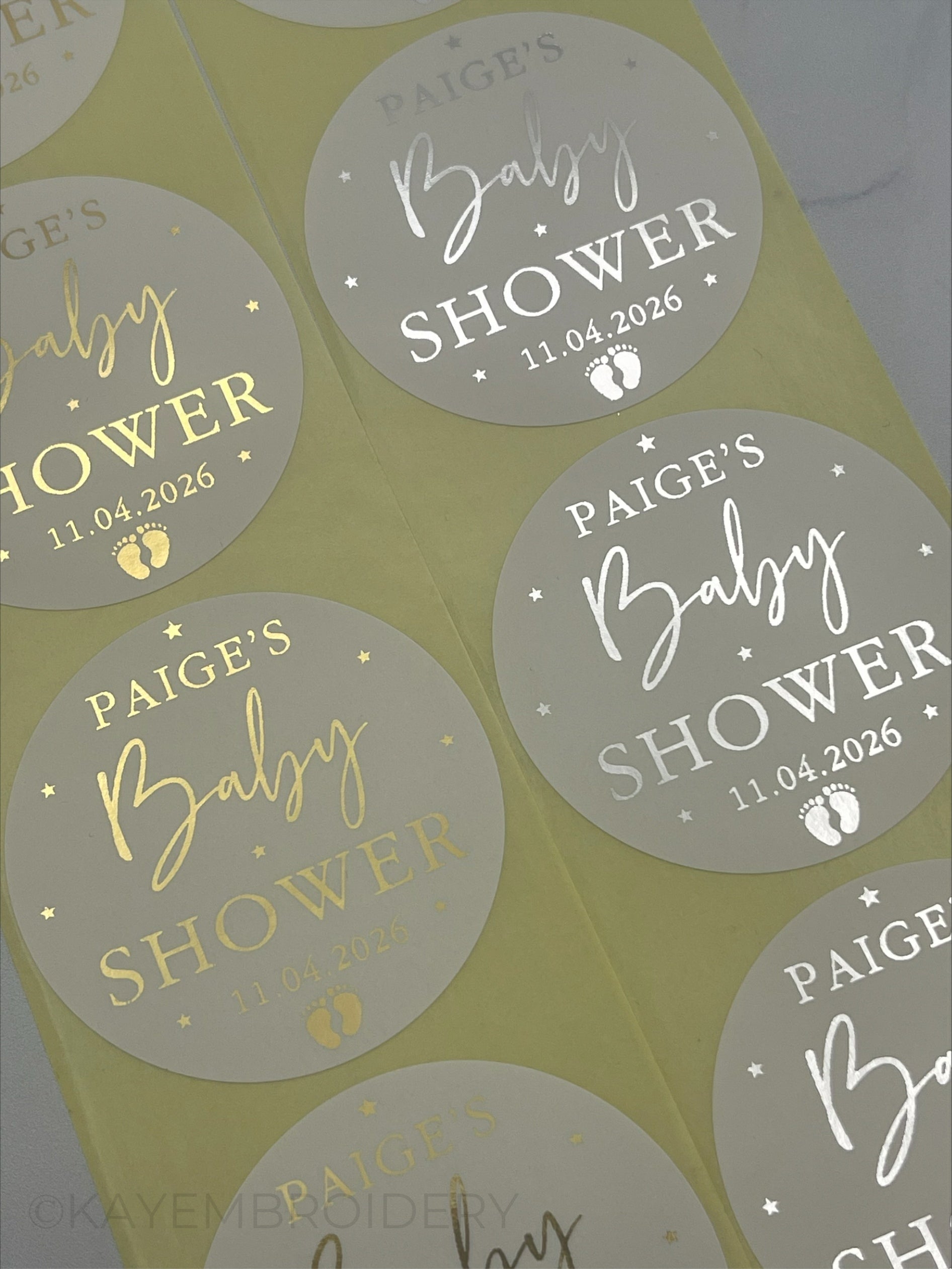 Baby Shower White Stickers foiled in Gold or Silver stars and baby feet. personalised with name and date