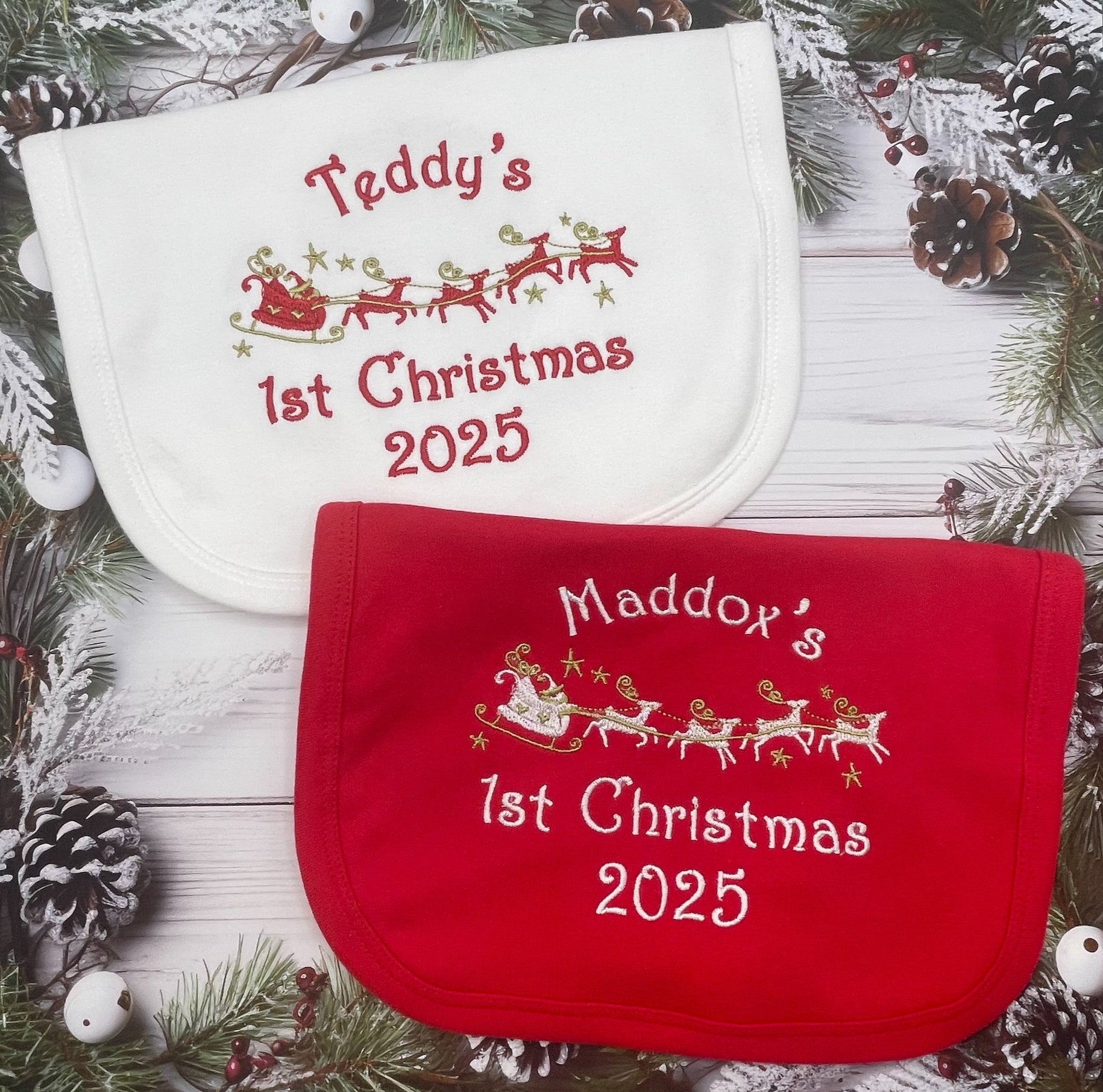 Red or white baby bib with name and 1st Christmas 2025' text on a festive background