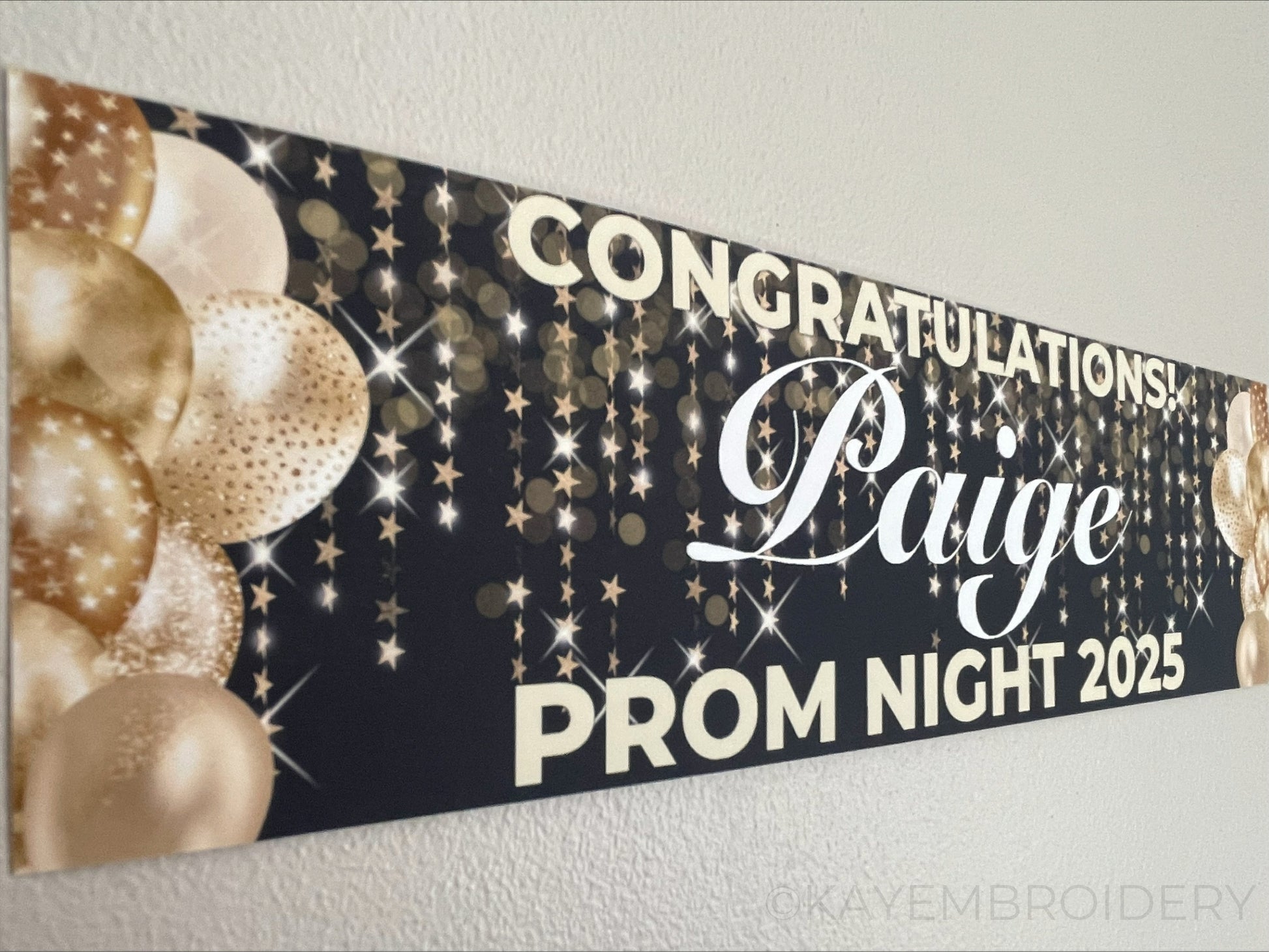 Black prom banner with stars and balloons in gold. Personalised with congratulations name and prom night with year