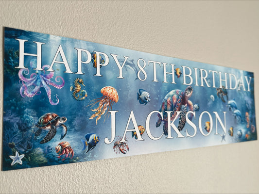Under the sea birthday banner with marine sea life. Personalised with name and age