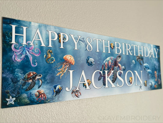 Under the sea birthday banner with marine sea life such as Turtle, Fish, Jellyfish, Octopus theme. Personalised with happy age birthday and name
