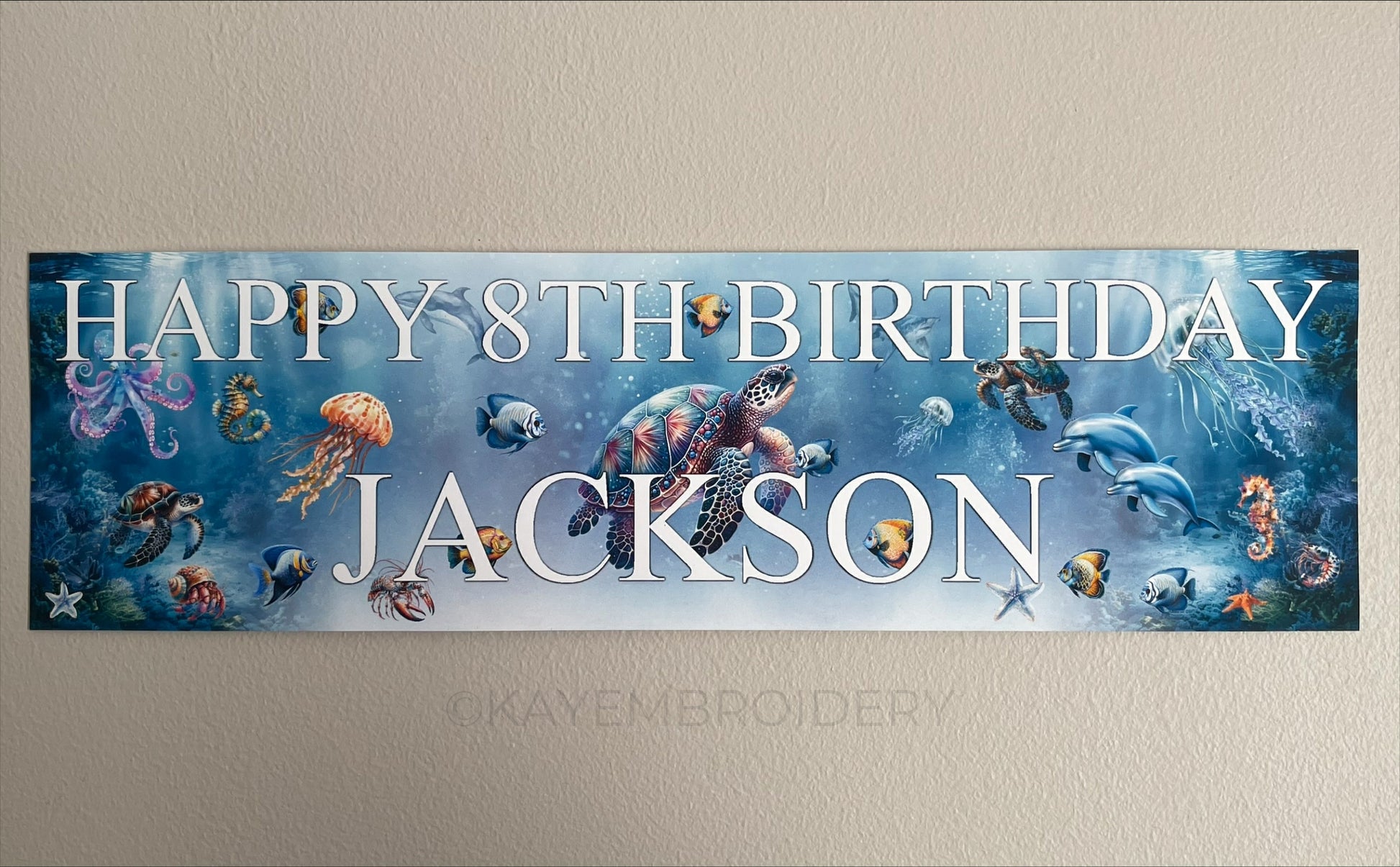 Under the sea birthday banner with marine sea life such as Turtle, Fish, Jellyfish, Octopus theme. Personalised with happy age birthday and name